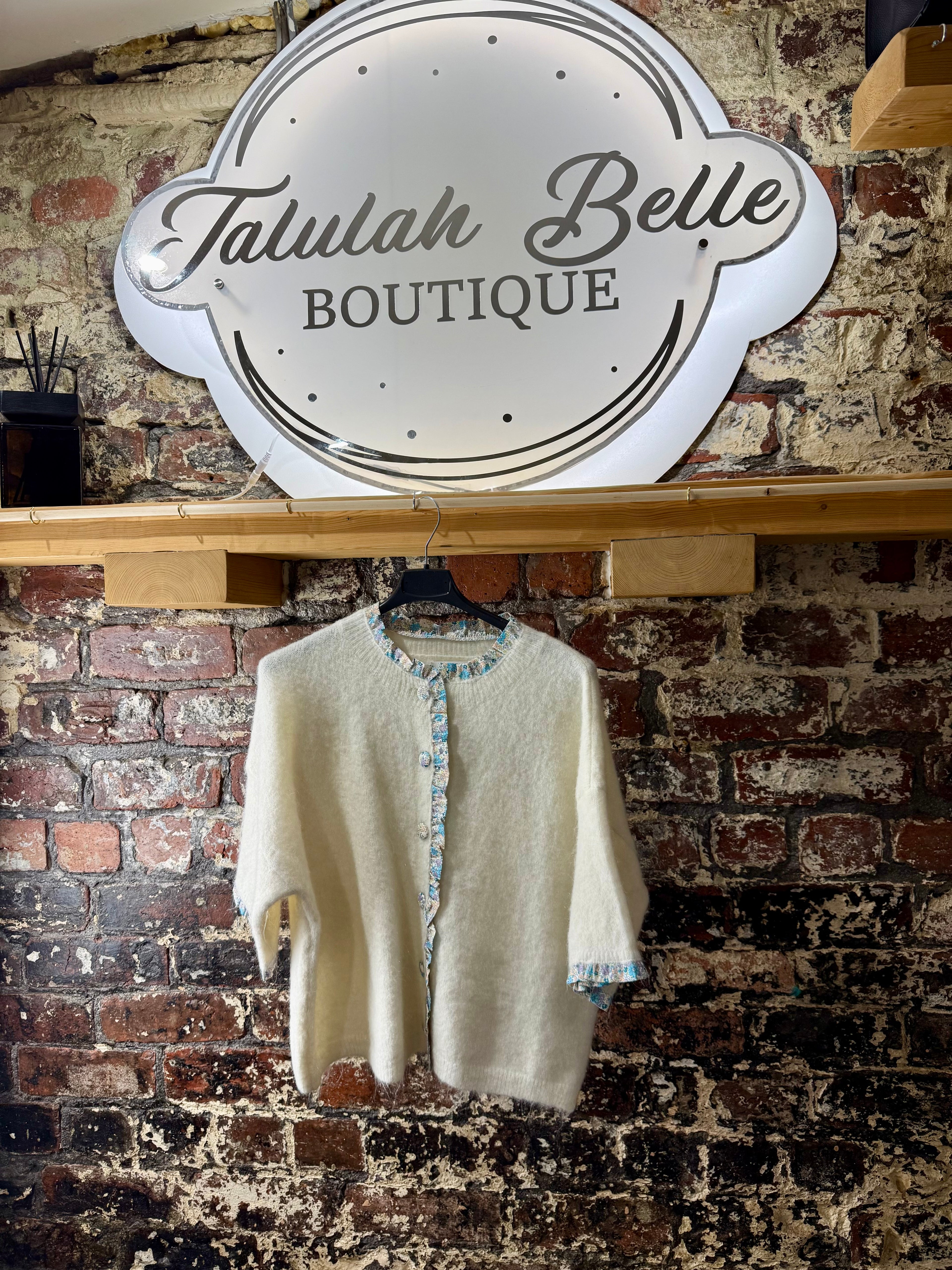Cardigan with inspired fabric trimmed buttons & delicate edges