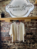 Cardigan with inspired fabric trimmed buttons & delicate edges