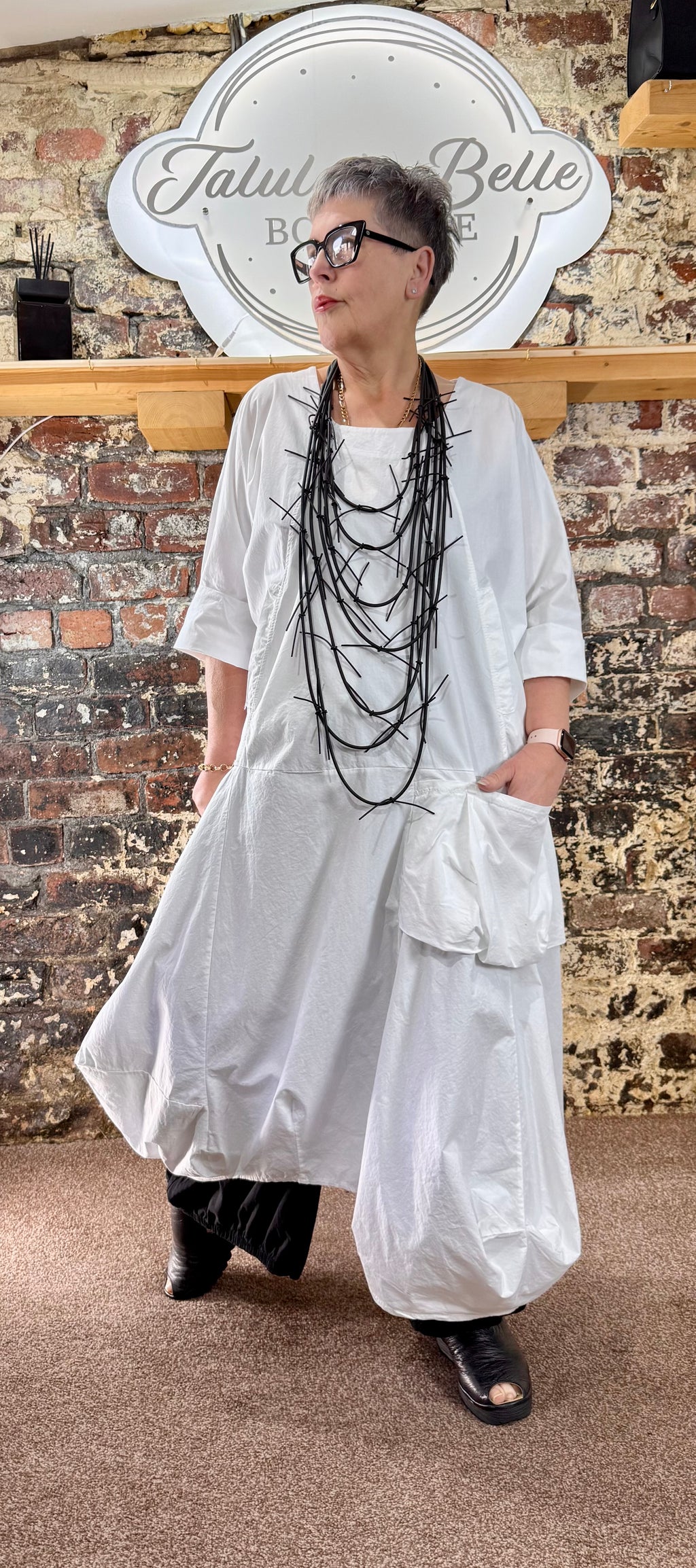 Quirky poplin cotton dress with oversized patch pocket.