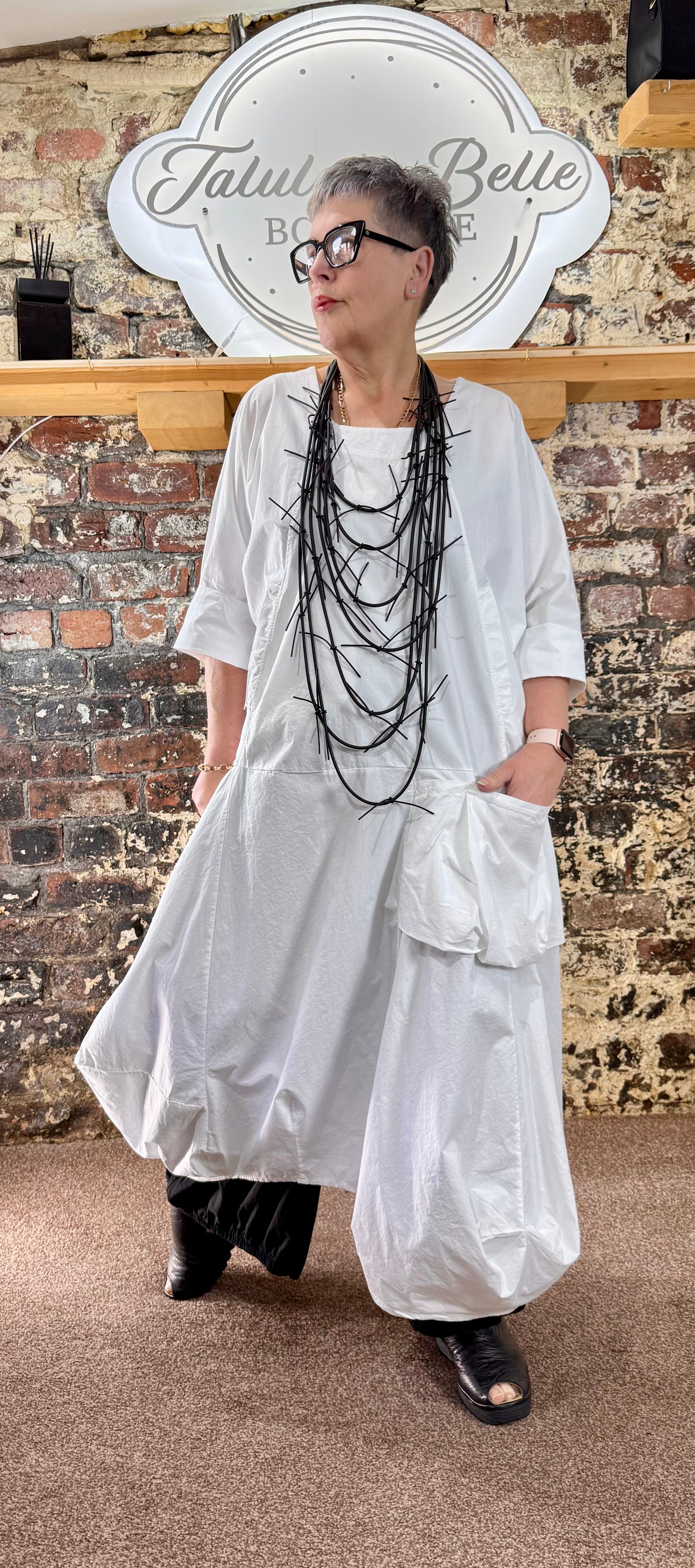 Quirky poplin cotton dress with oversized patch pocket.