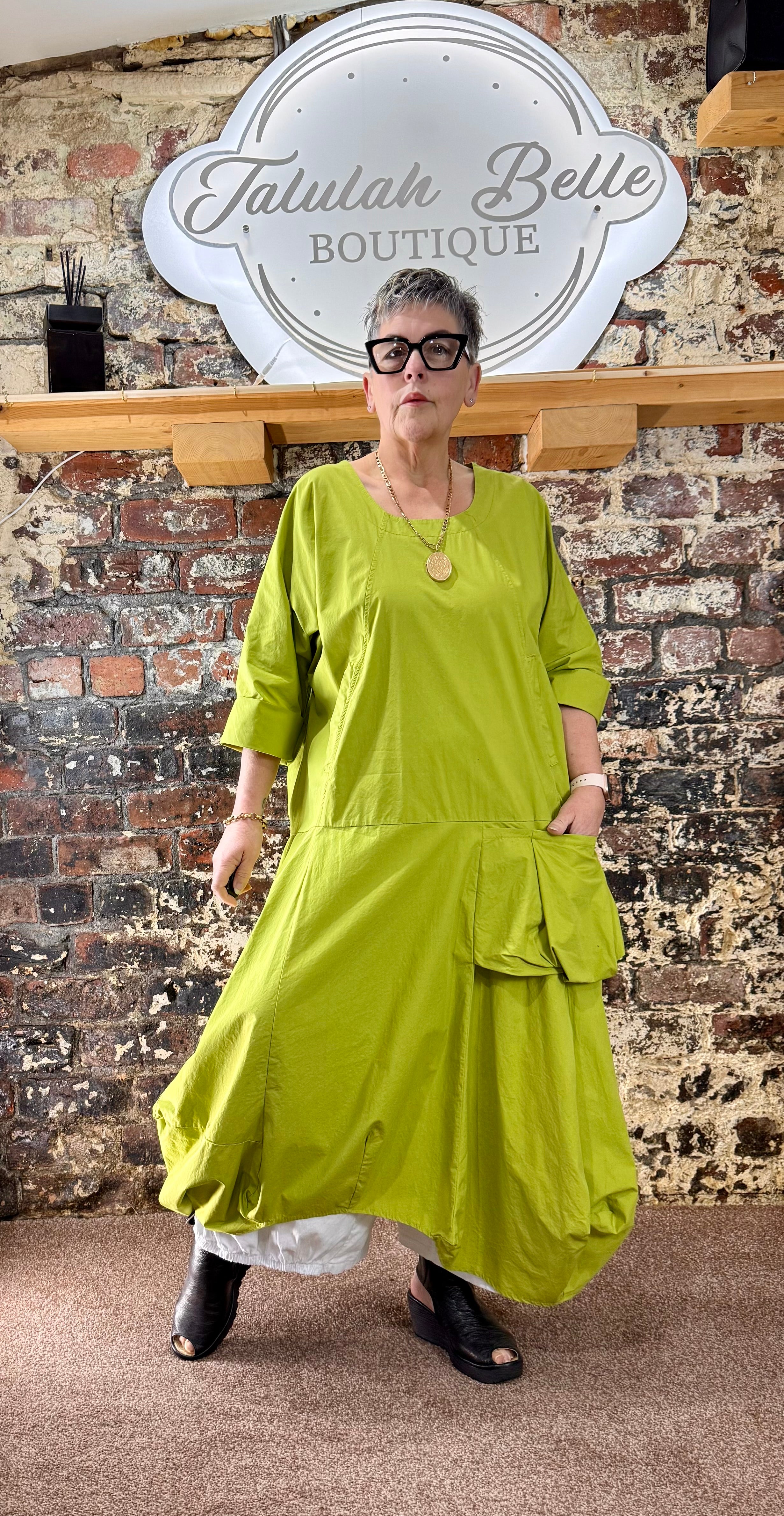 Quirky poplin cotton dress with oversized patch pocket.