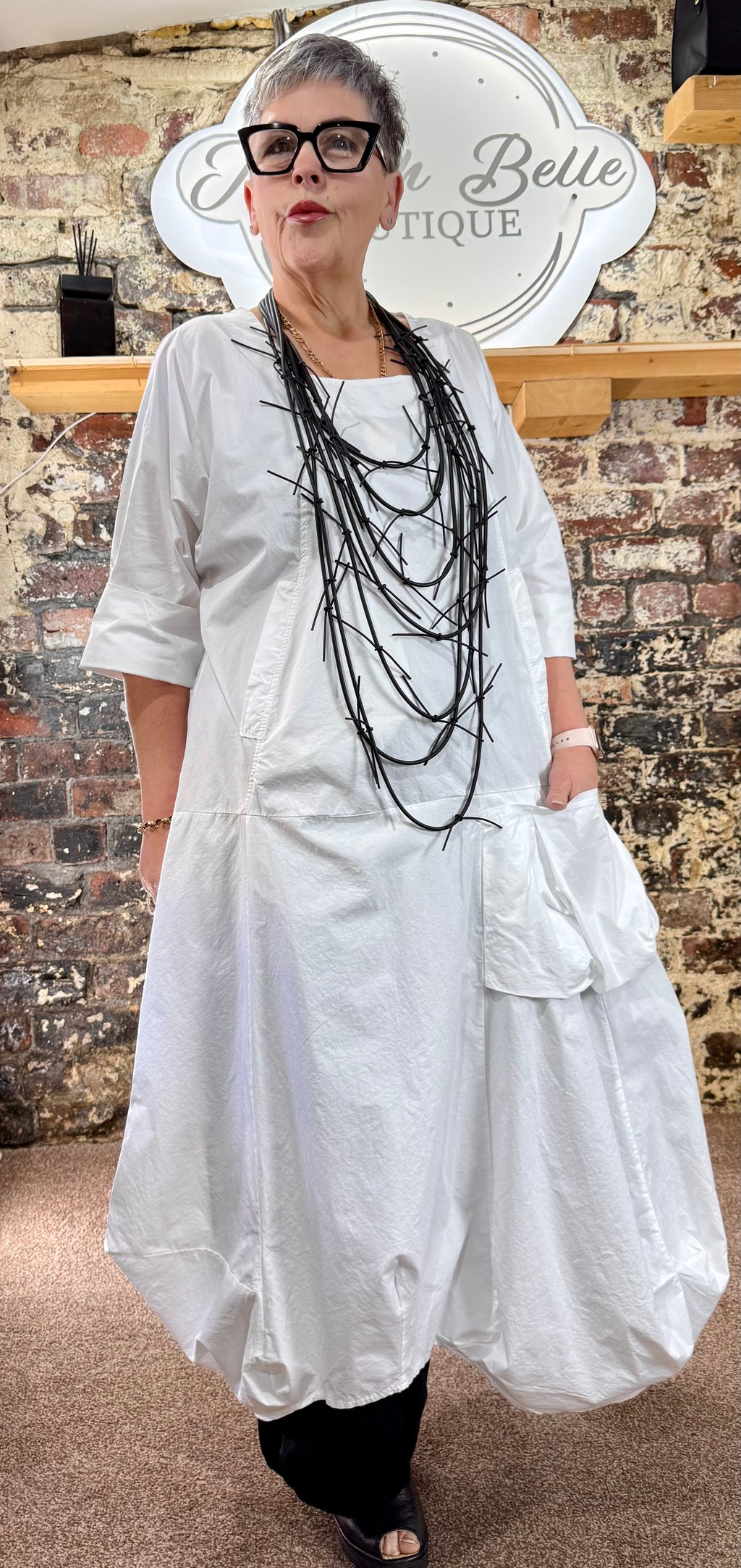 Quirky poplin cotton dress with oversized patch pocket.
