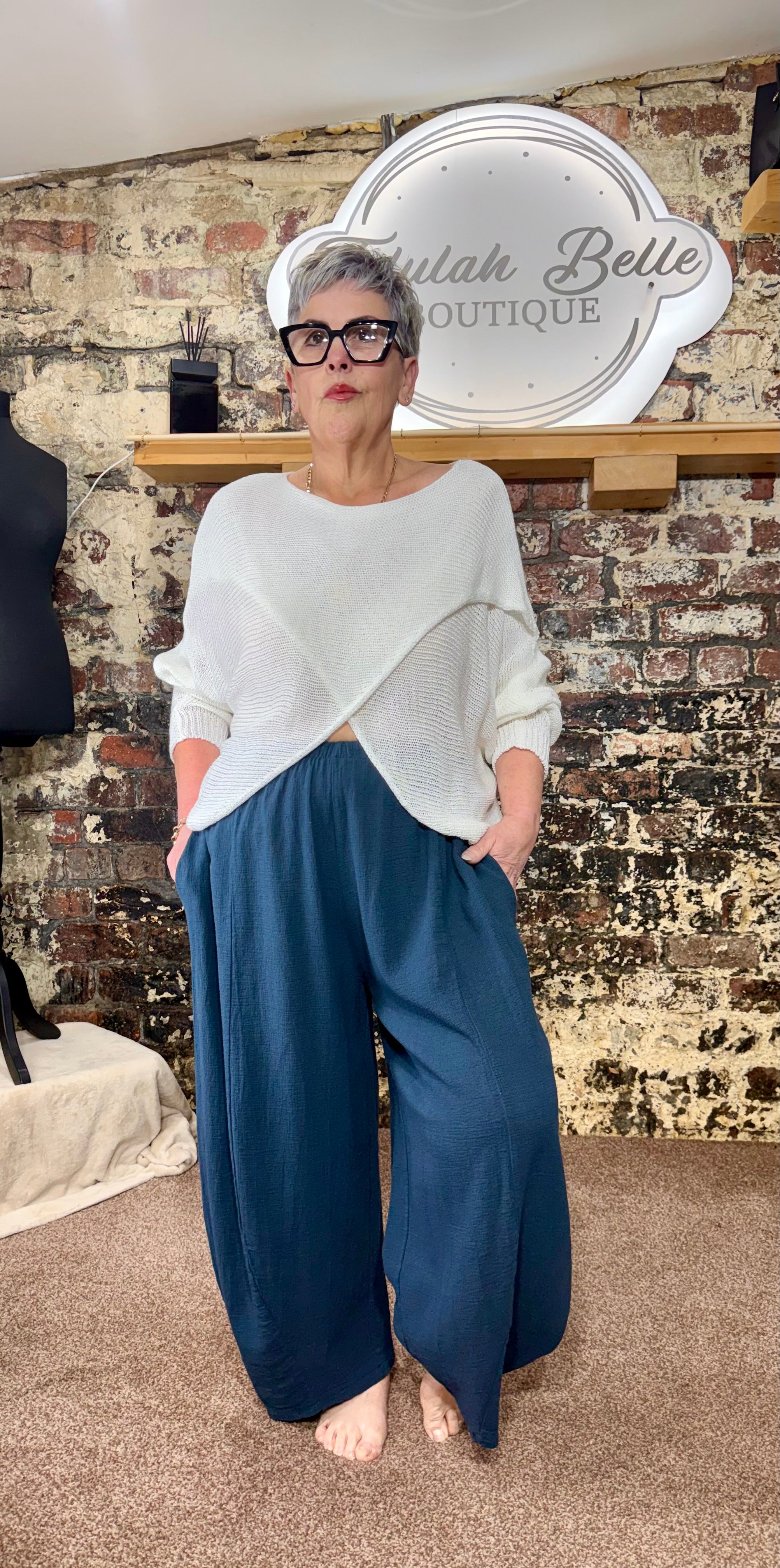 Summer weight longer length crossover knit.