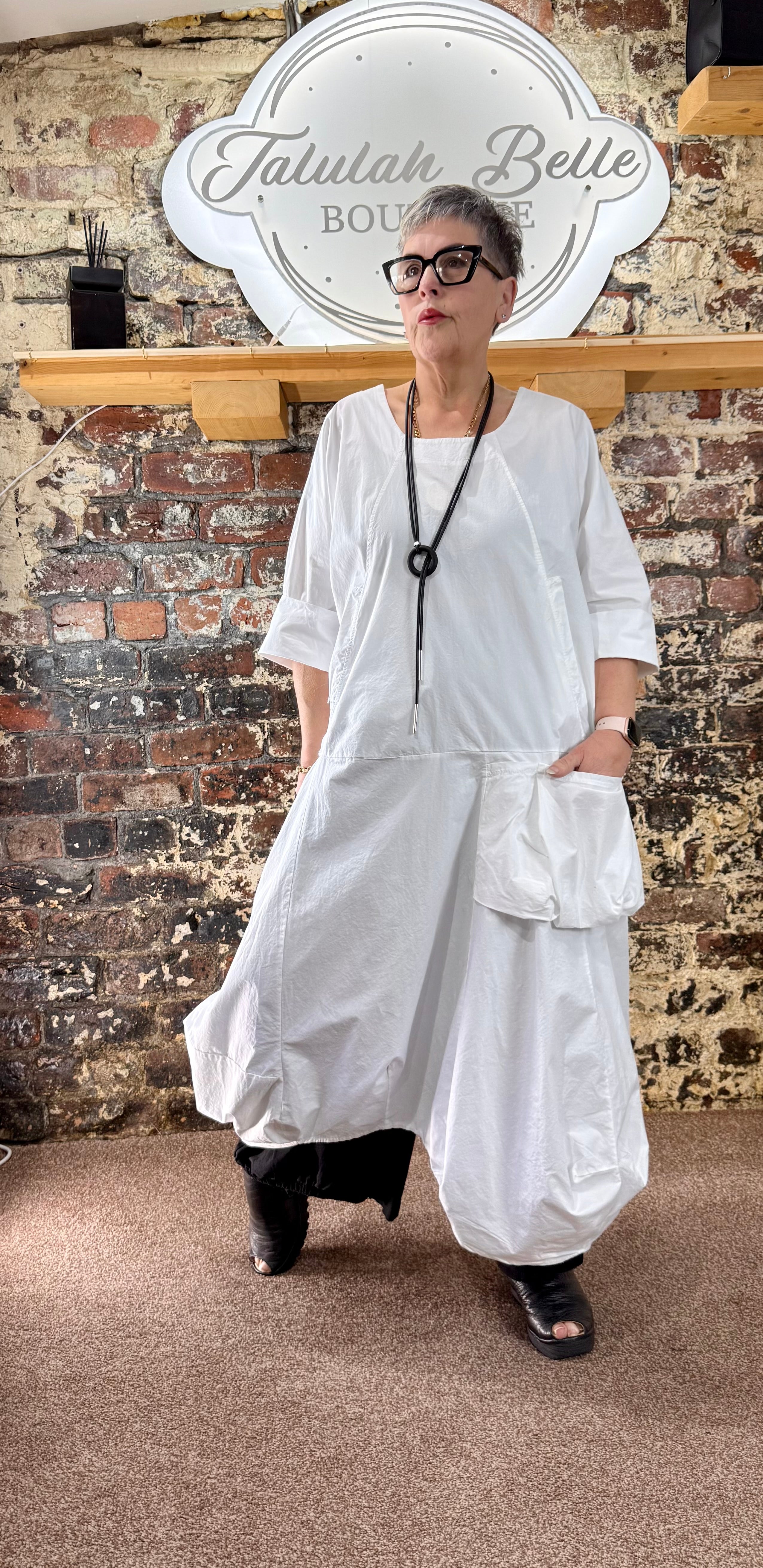 Quirky poplin cotton dress with oversized patch pocket.